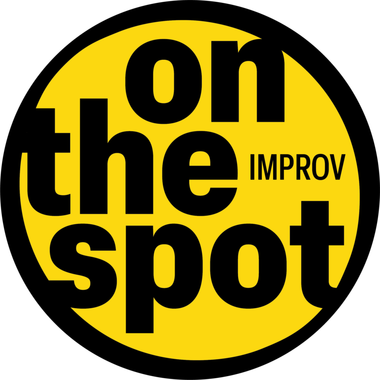 on the spot improv logo black and yellow take note troupe
